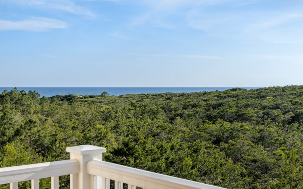Step out onto the balcony at Santa Rosa Beach House on 30A, and take in the views and sounds of the Gulf and Topsail State Park. 
