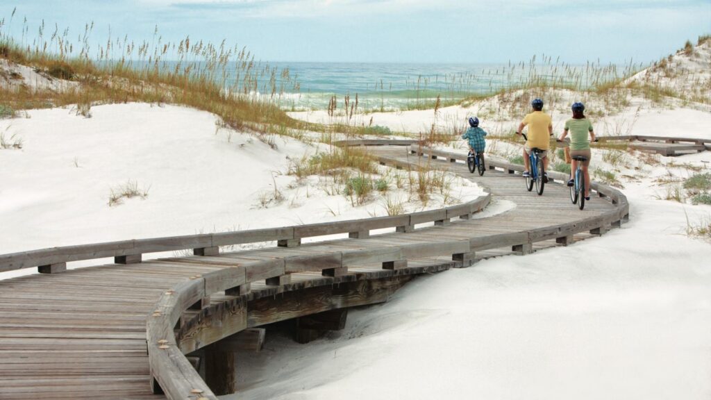 A family biking through the 30A dunes.